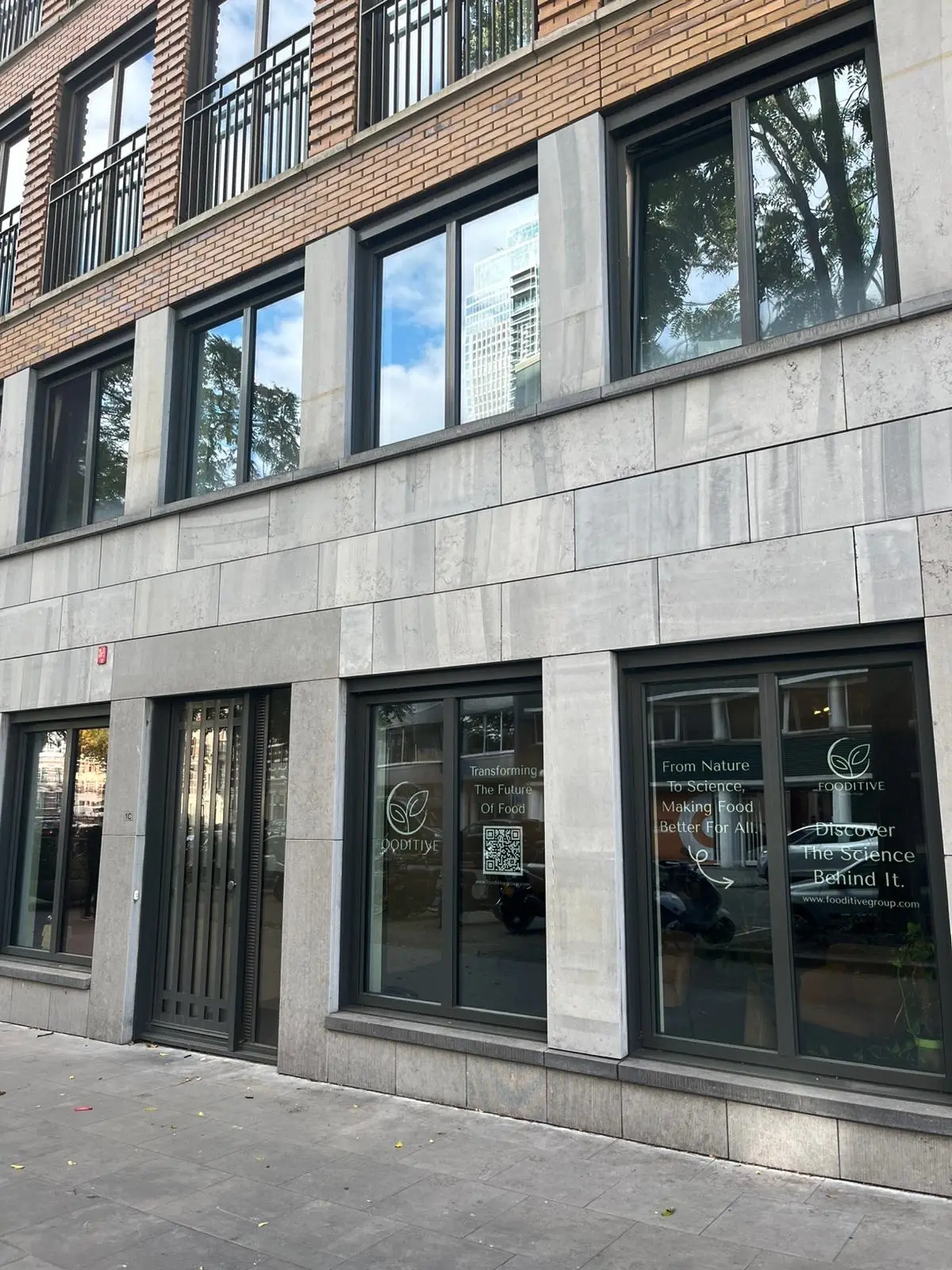 Street-level view of the building in Rotterdam where Fooditive has its office, with Fooditive window lettering